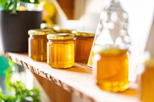 20230526213249_[fpdl.in]_natural-honey-various-jars-wooden-shelf-souvenir-village-market_308547-6220_normal